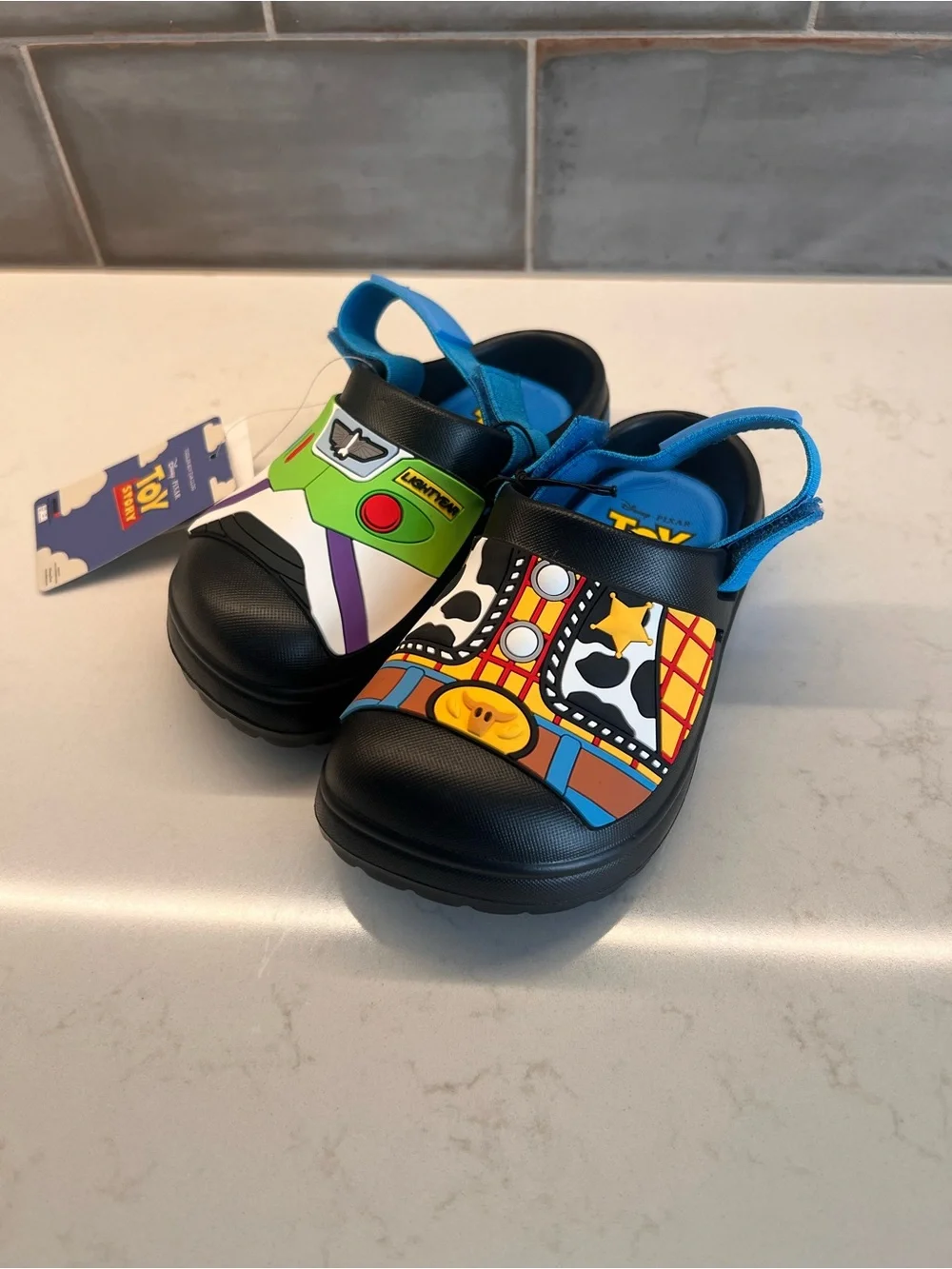 Kids Black Toy Story Slip-On Clogs with Blue Strap